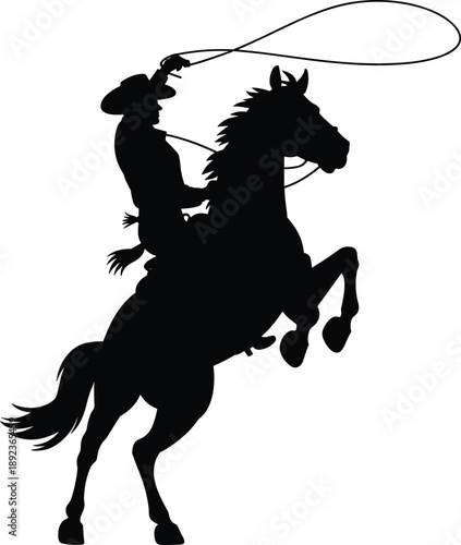 Action silhouette of a cowboy riding a rearing horse and throwing a lasso, representing western heritage, rodeo sports, and ranching.