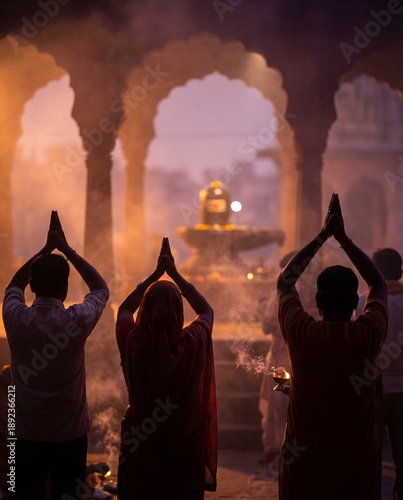 Devotees praying to Shiva lingam inside temple during Hindu worship
