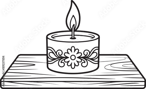 Burning candle on wooden plank with floral ornaments peaceful and romantic atmosphere decoration for relaxation