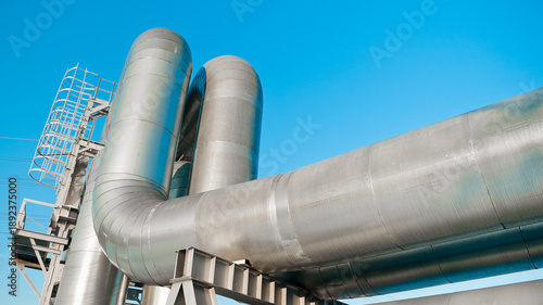 close-up of a pipeline against a blue sky