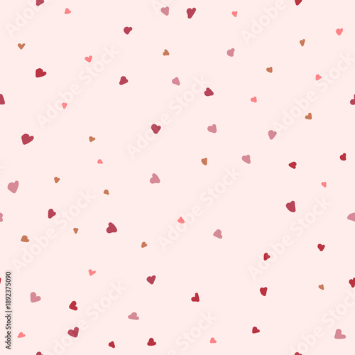 Seamless pattern of small, random reddish hearts, for minimalist design and packaging