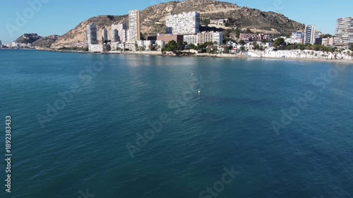 Wallpaper Mural Aerial approach to the Serra Grossa hill from the sea, Alicante, Spain, with a flock of birds crossing in front of the camera Torontodigital.ca