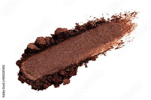Shimmery cocoa powder smear, textured edge, dark background