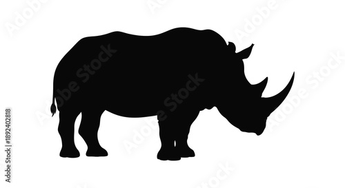 A striking black silhouette depicts a powerful rhinoceros standing in profile showcasing its iconic horn and robust form silhouette