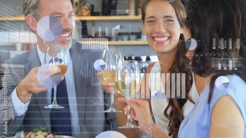 Animation of financial data processing over diverse colleagues eating dinner