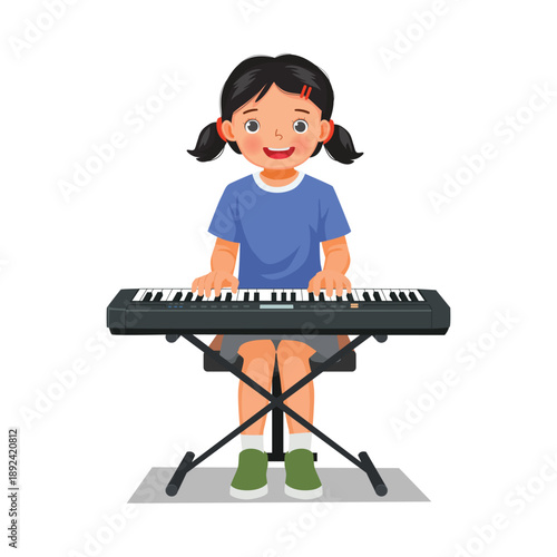 Little girl playing electric piano or keyboard 