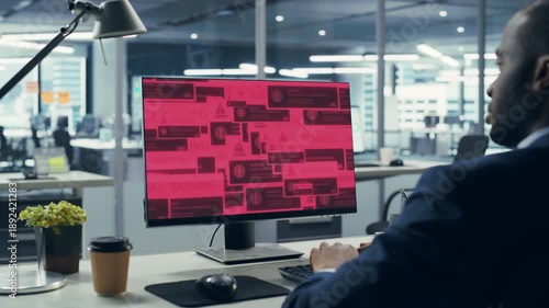 Wallpaper Mural Office Male Professional Watches His Workstation Get Hacked as Malware Virus Popups Show Ransomware Encryption, Credential Theft, Data Threats to Corporate Systems and Business Cyber Attack Torontodigital.ca