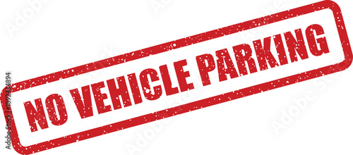A clear red rubber stamp stating NO VEHICLE PARKING with a textured effect against a bright white background