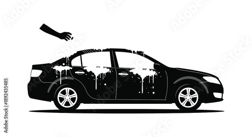 A sleek black car is being washed with foamy soap creating a dramatic visual effect a silhouette