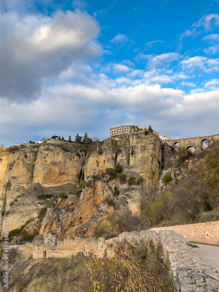 Fototapeta premium El Tajo Gorge and Puente Nuevo Bridge in the City of Ronda at Sunset, Andalusia, Spain