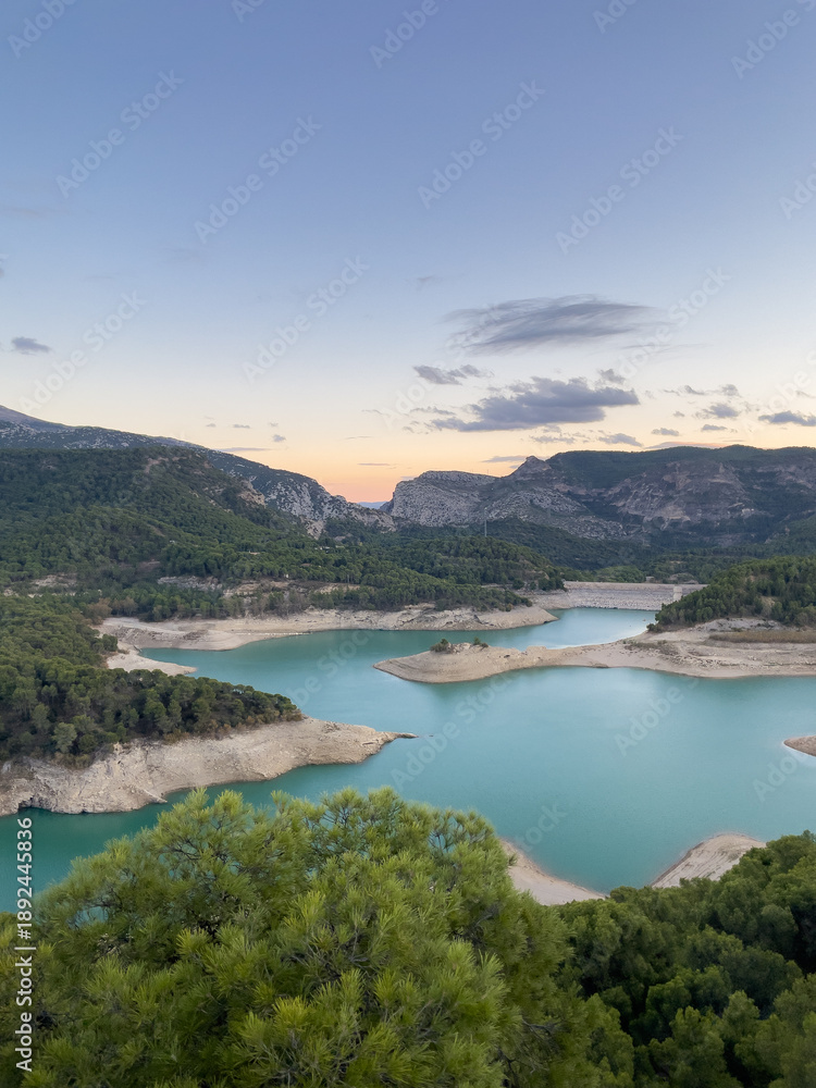 Obraz premium Landscape View of Guadalhorce Dam Affected by Water Shortage at Sunset, Andalusia, Spain