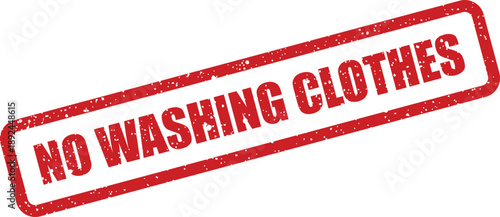 A stark red rubber stamp communicates the clear message NO WASHING CLOTHES against a white backdrop
