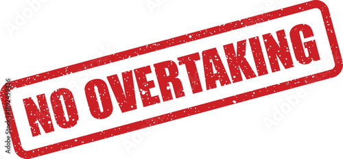 Red textured rubber stamp clearly indicating the rule NO OVERTAKING presented on a clean white surface