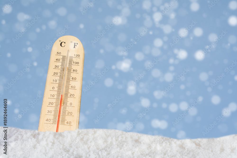 Wall Mural Outdoor thermometers show sub-zero temperatures during severe snowstorms, indicating extreme cold and weather conditions