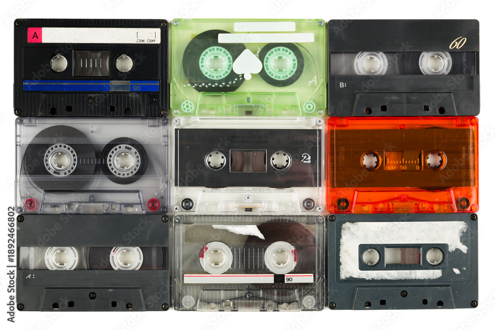 Naklejka premium Set of retro cassette tapes variety, isolated on white background. Top view.