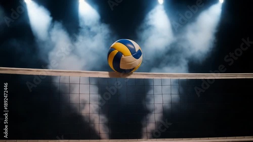 A volleyball rests on the net during a dramatic sports event. Confetti falls under bright spotlights, celebrating a victory.