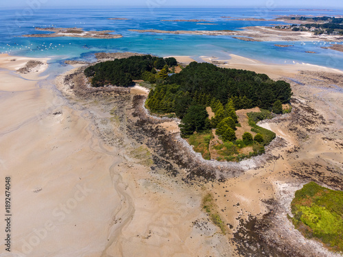 Obraz na plátně Aerial view of Île Aval in Brittany, France, showcasing its lush green landscape surrounded by deep blue Atlantic waters, highlighting the island’s natural beauty and coastal isolation