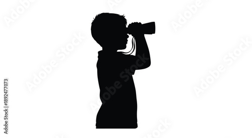 Silhouette of a young boy observing through binoculars