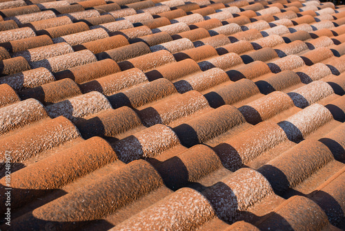 Quadro su tela Close-up of metal wavy roofing tiles under bright sunlight