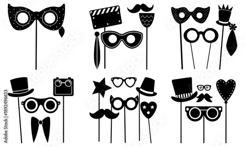 Collection of black props including masks, hats, and accessories displayed on sticks against a clean background, perfect for events and parties.