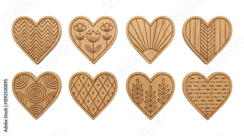 Engraved wooden heart set including floral, geometric, chevron, sunburst, and leaf patterns isolated. Romantic decoration and craft collection.