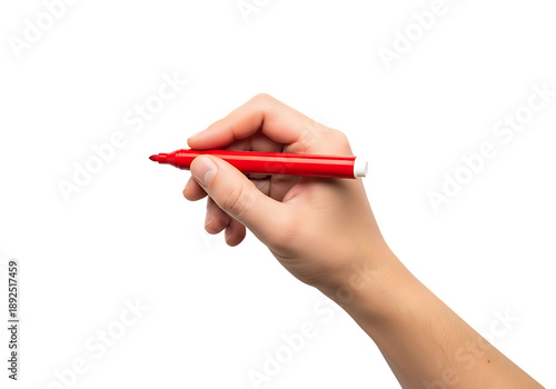 Hand holding red marker pen writing on blank surface close-up