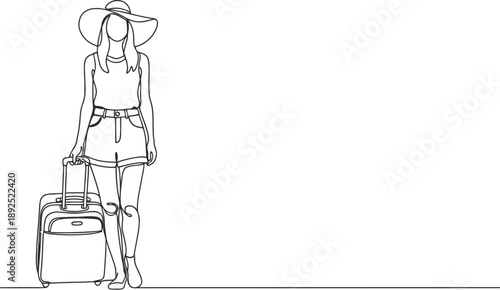 Woman standing with luggage and hat