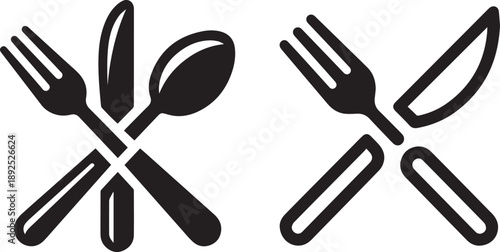 An isolated set of metal cutlery including a fork, spoon, and knife along with a plastic spatula used as essential kitchenware tools for cooking and dining on a white background