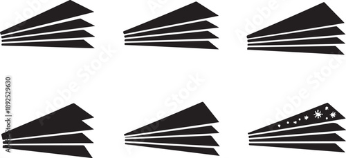 Black and white paper airplanes in various flight patterns