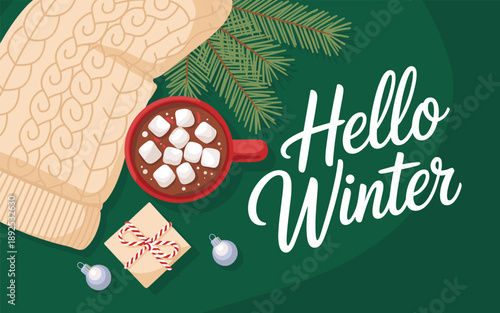 Cozy winter scene with knitted gloves holding a warm mug of hot chocolate with marshmallows and evergreen branches around