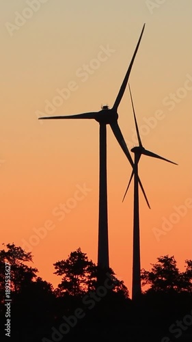 wind power at sunrise red sky, vertical  video
