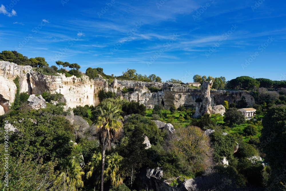 Fototapeta premium The Latomia del Paradiso is an ancient limestone quarry located within the Neapolis Archaeological Park in Syracuse, Sicily.