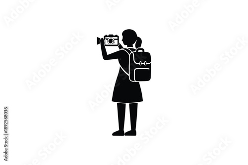 Female photographer wearing backpack holding camera taking pictures representing travel hobby and outdoor trip