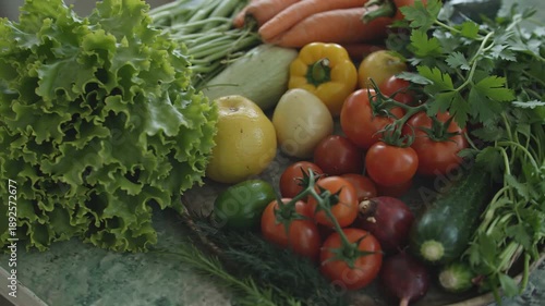 Freshly harvested garden vegetables arranged beautifully on a rustic surface, showcasing vibrant colors.