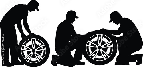 Three black silhouettes of men working on car tires on a white background