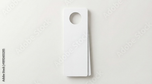 Modern white door tag with circular hole on clean background