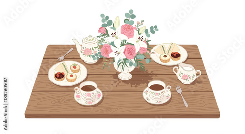 Top View of a Tea Time Table Setting with Floral Centerpiece Teapot Cups and Small Cakes