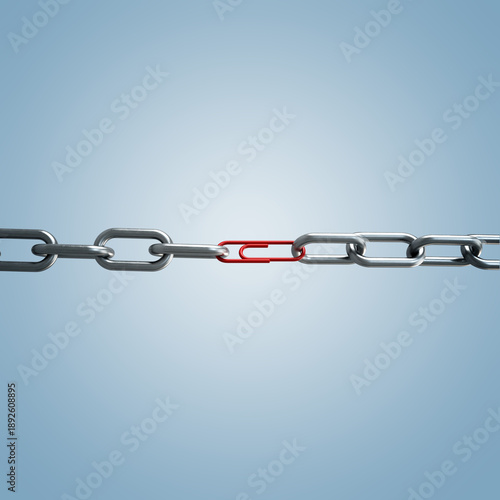 Fényképezés Conceptual studio shot of a metal chain linked together by a fragile red paperclip