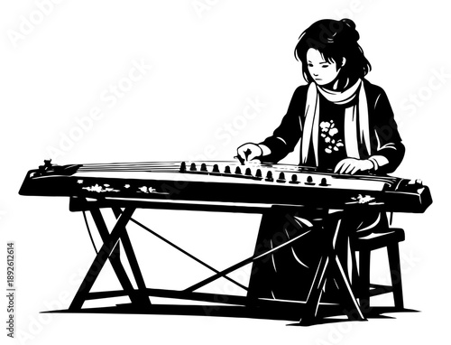 Young woman in traditional dress playing guzheng zither musical instrument