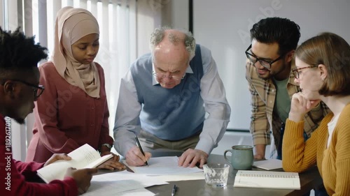 Experienced senior coach leading diverse team collaboration