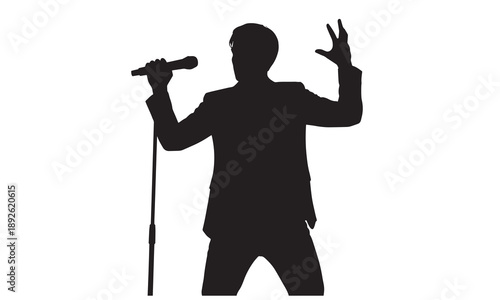 Silhouette of a man in a suit holding a microphone and gesturing energetically.