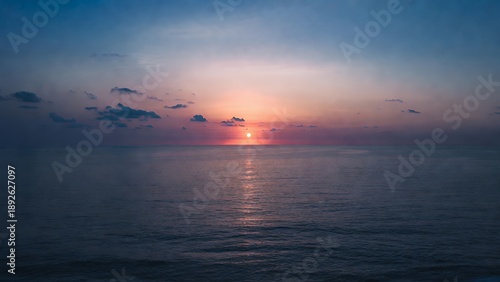 Crimson Horizon: Serene Ocean Sunset with Golden Reflections