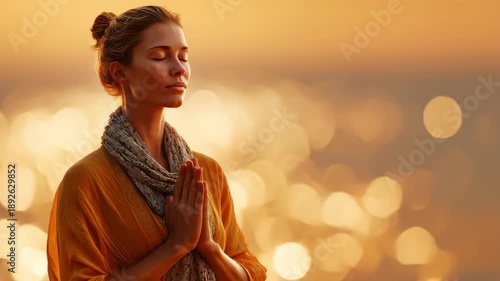 Young woman finding peace and calm during an outdoor meditation session at sunset, copy space