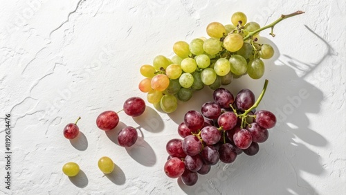 Fresh Grapes in Various Colors on Light Background with Natural Shadows and Textures