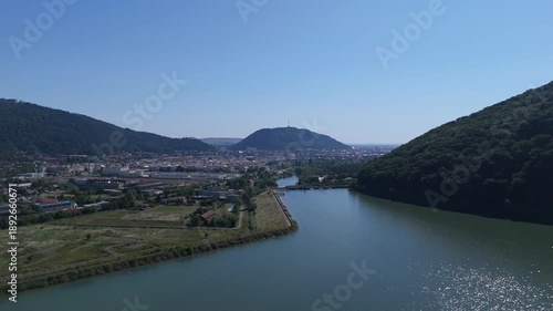 Wallpaper Mural Aerial view of Piatra Neamt city surrounded by hills and natural landscape in Romania Torontodigital.ca