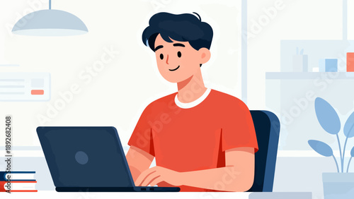 A man is sitting at a desk with a laptop in front of him. He is smiling and he is enjoying his work