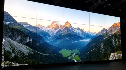 Stunning display of mountain scenery on a large digital screen.