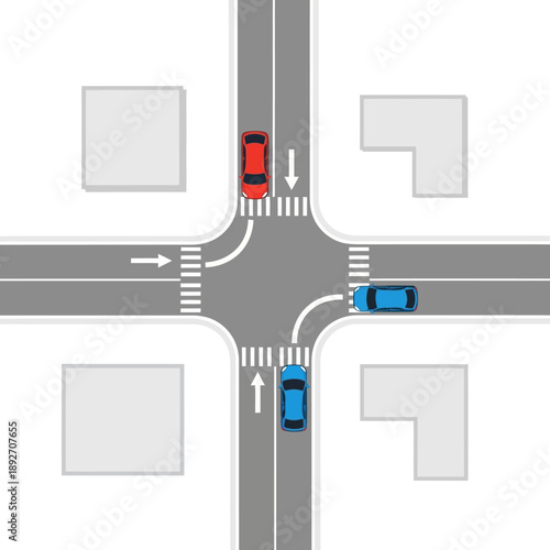 Top view of a busy traffic intersection with cars navigating crossroads and pedestrian crossings.
