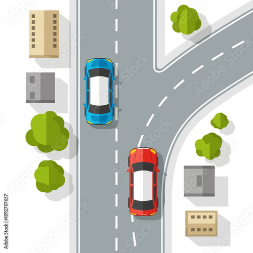 Top view of cars on a road junction with buildings and trees