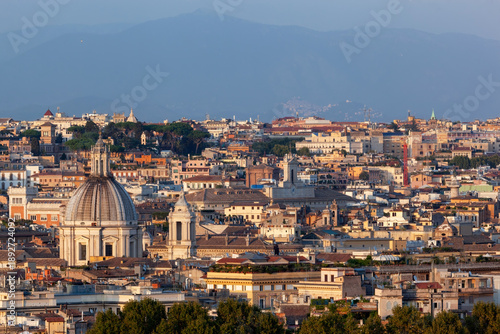 Panoramic view of Rome's cityscape with iconic architecture under a clear sky